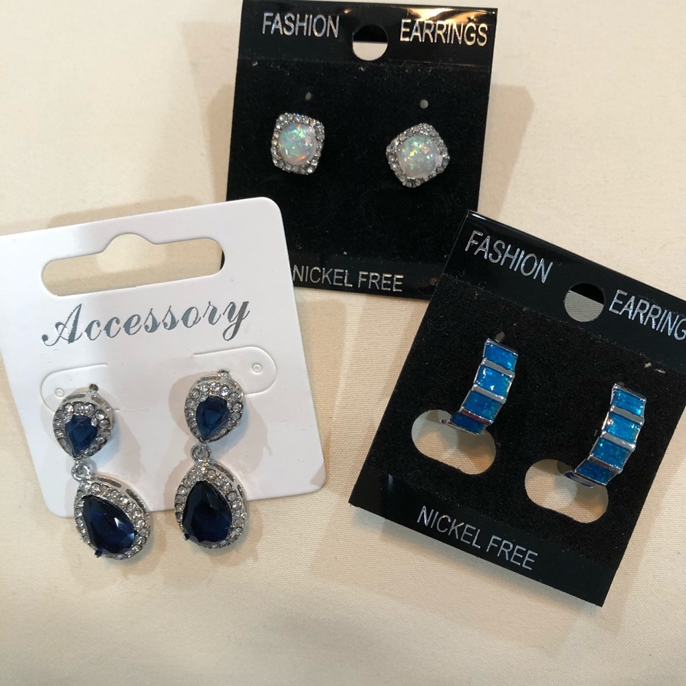 three pairs of earrings of different styles